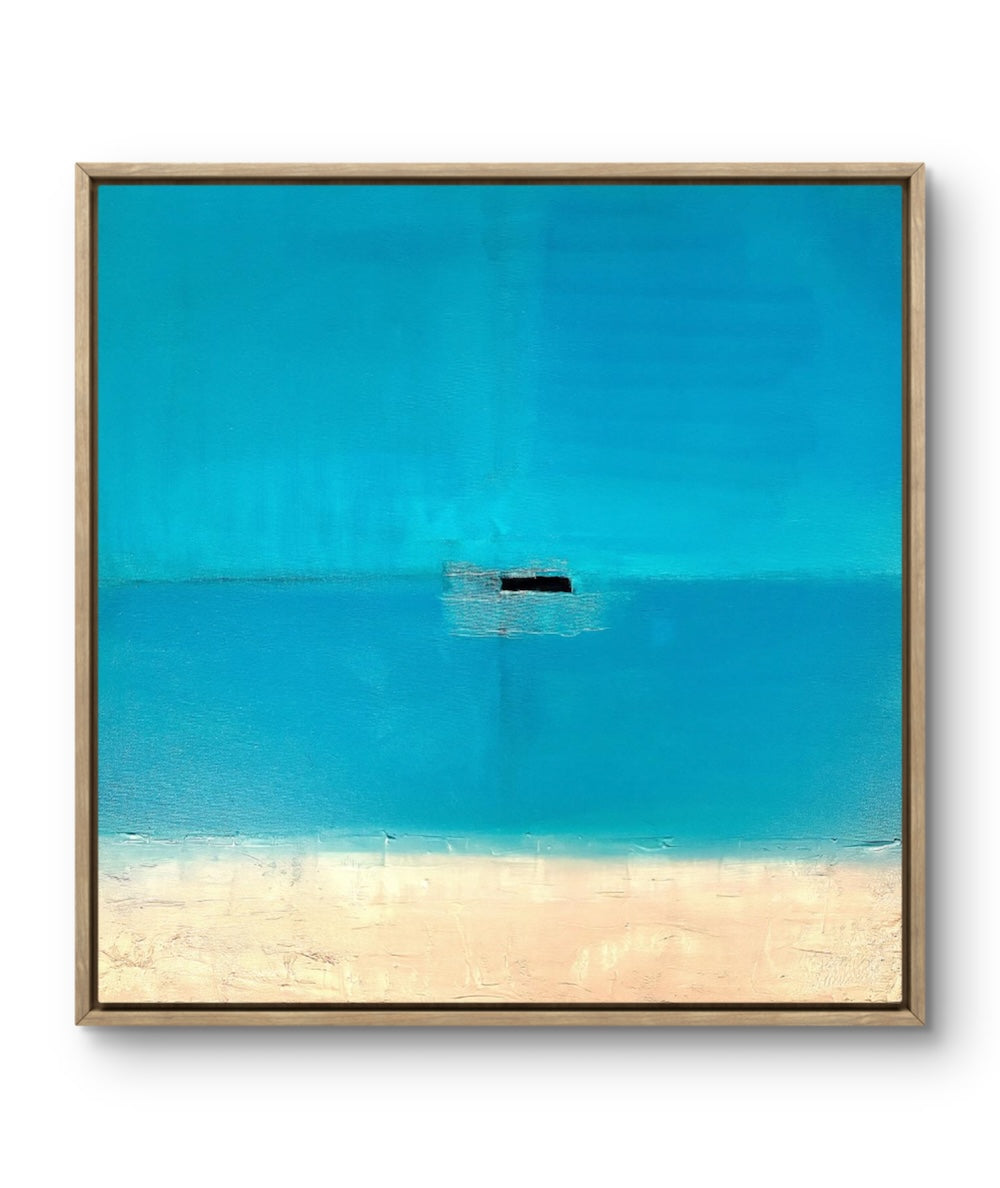 Framed artwork of a beach scene with clear blue water and sand.