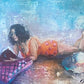 Artistic depiction of a woman in an orange polka dot dress lying on a textured surface.
