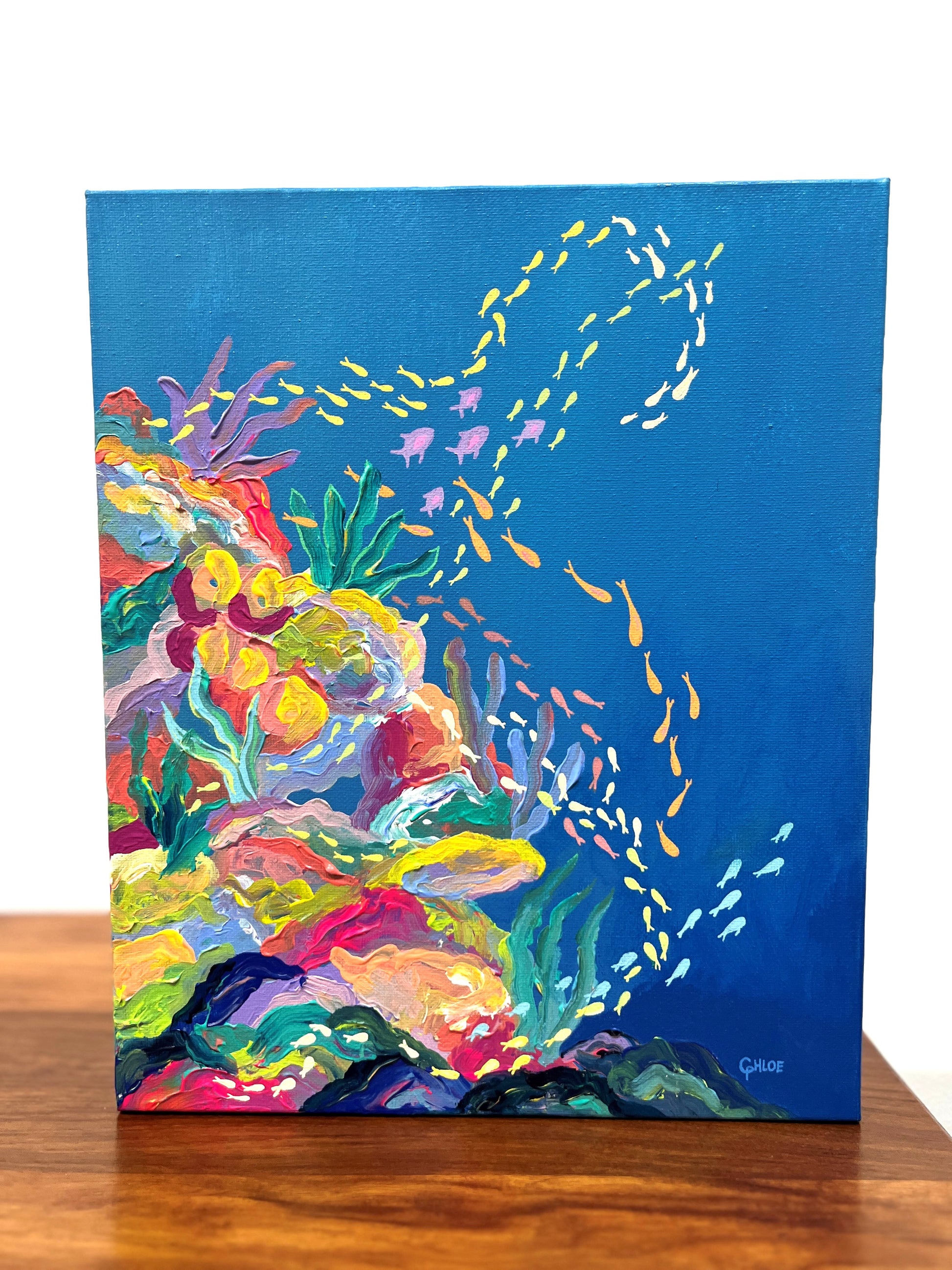 Colorful underwater scene painting on a blue background