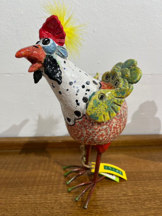 Decorative chicken on a wooden surface