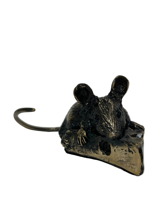 A small metal mouse figurine with a dark oxidized finish and a gold-toned base, photographed on a plain white surface against a white background.