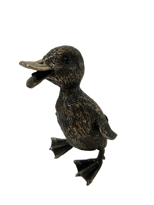 A small duck figurine with a textured metallic bronze finish, standing on a white surface against a white background.
