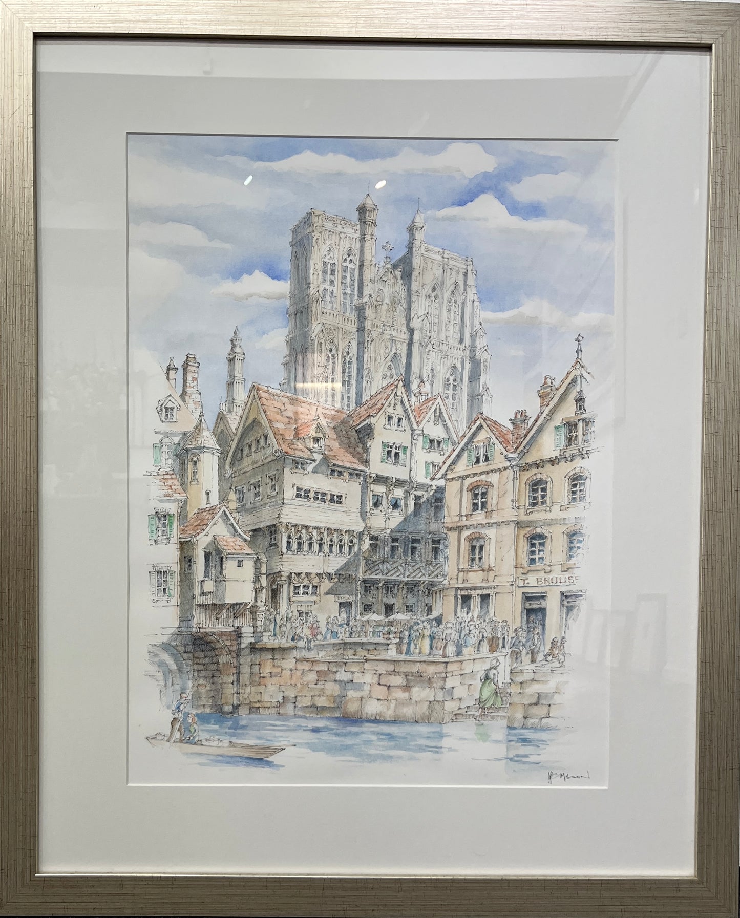Framed watercolor painting of a cityscape with a prominent cathedral.