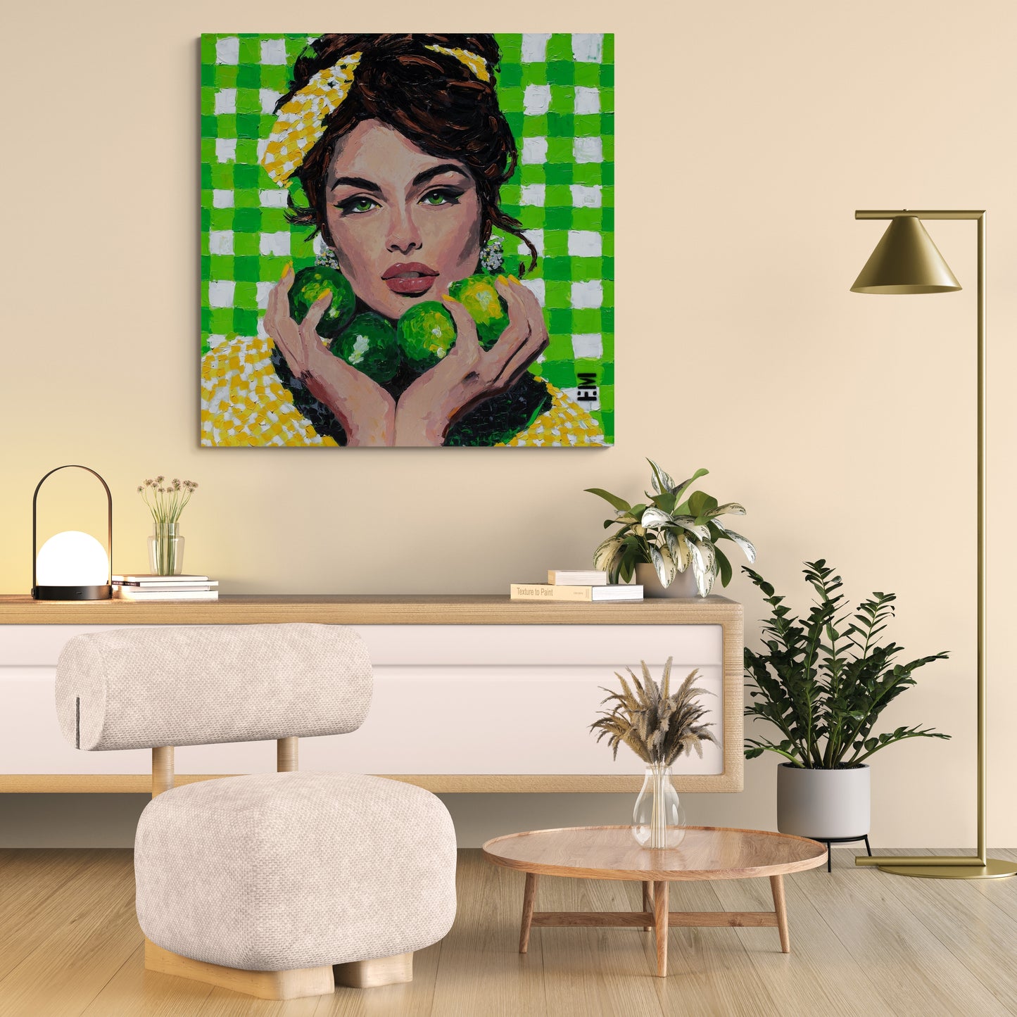 A colorful canvas wall art print depicting a woman with a yellow and green checkered headscarf holding green apples, displayed in a modern living room setting above a wooden console table.